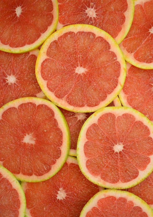 a group of slices of gfruit sitting next to each other