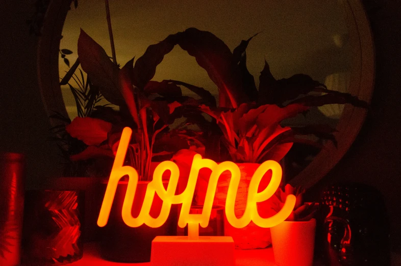 there is a light up sign that says home