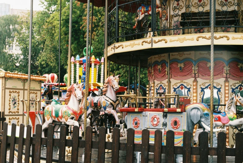 two carousels with one on a black horse