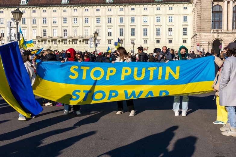 people in a parade holding up an up sign