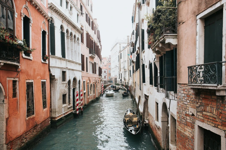 some boats on a river in an alley