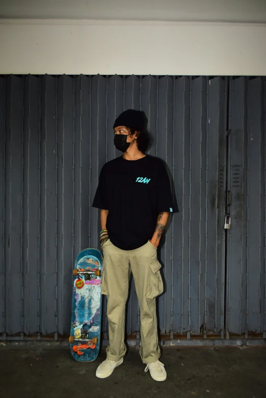 a man in a black shirt with a skateboard