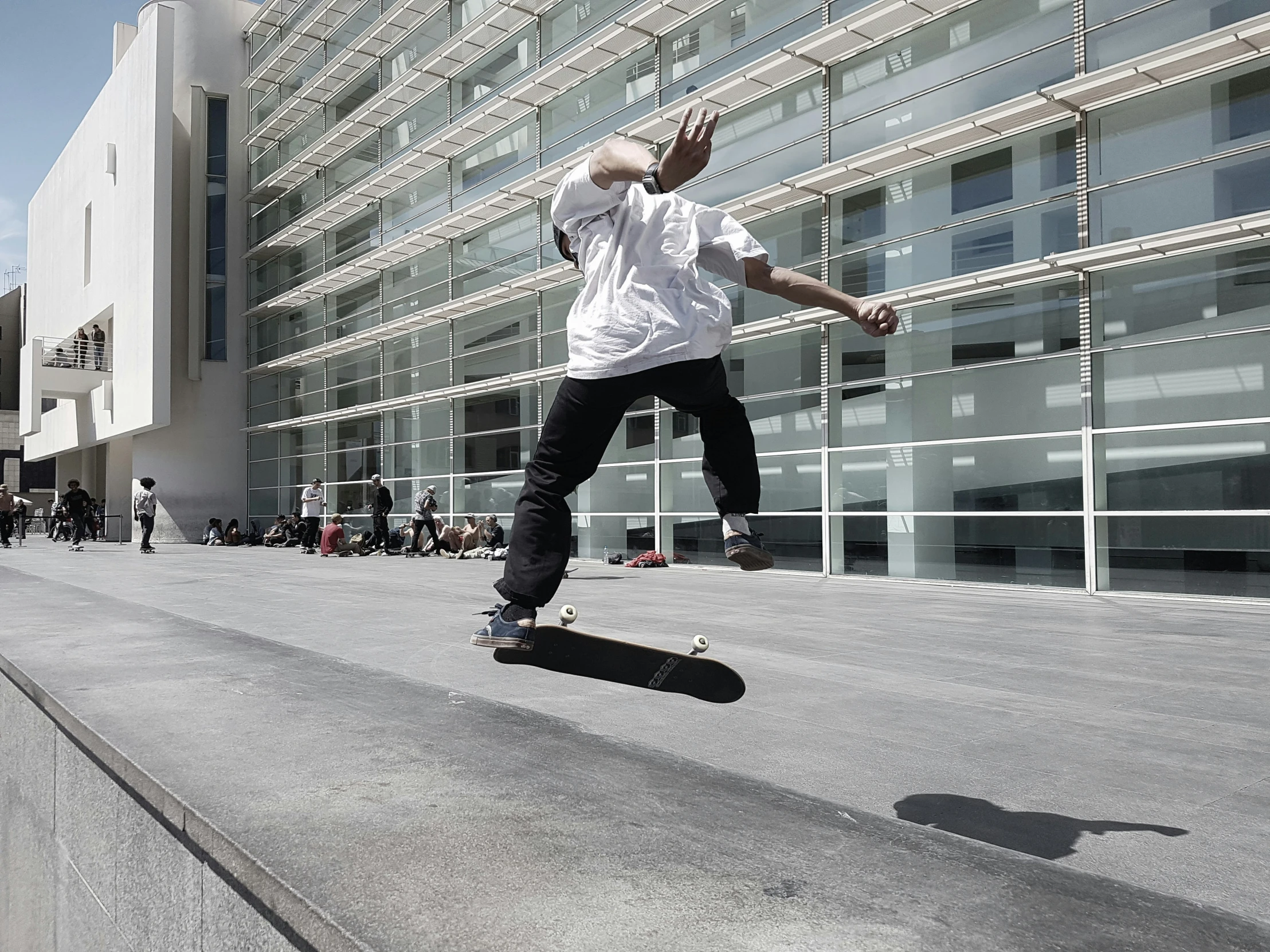 a skateboarder is riding on the side of a building