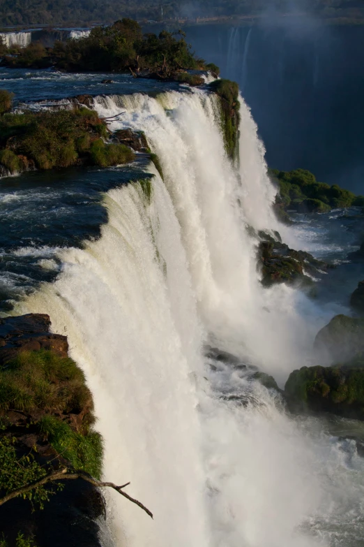 two water - fall towers stand in the middle of an open area