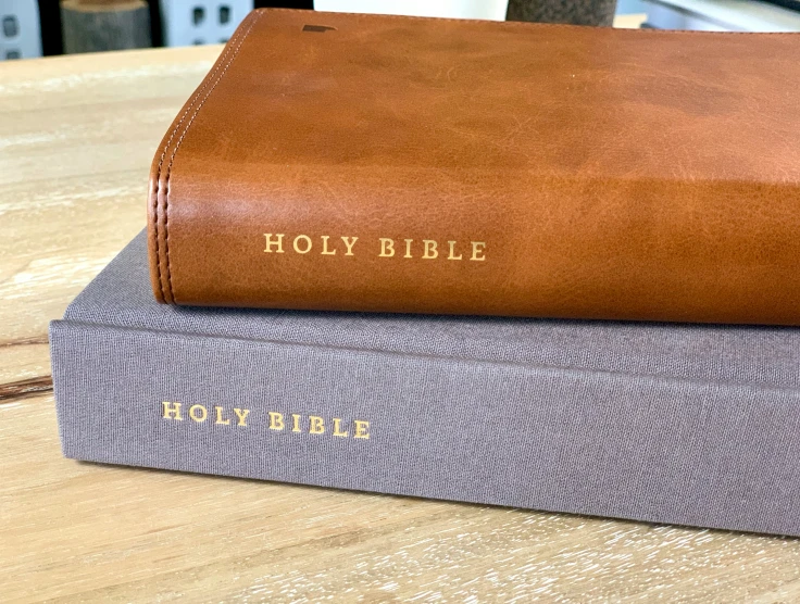 a book on the table with a bible sitting on top