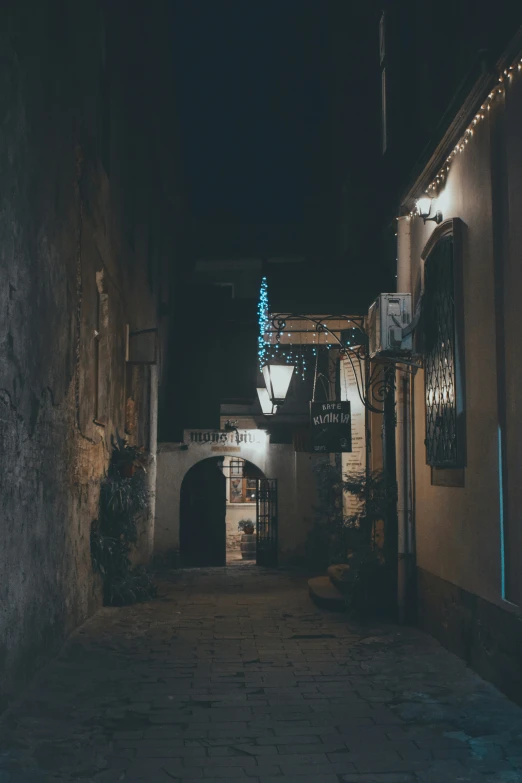 an alley way with lights on each side