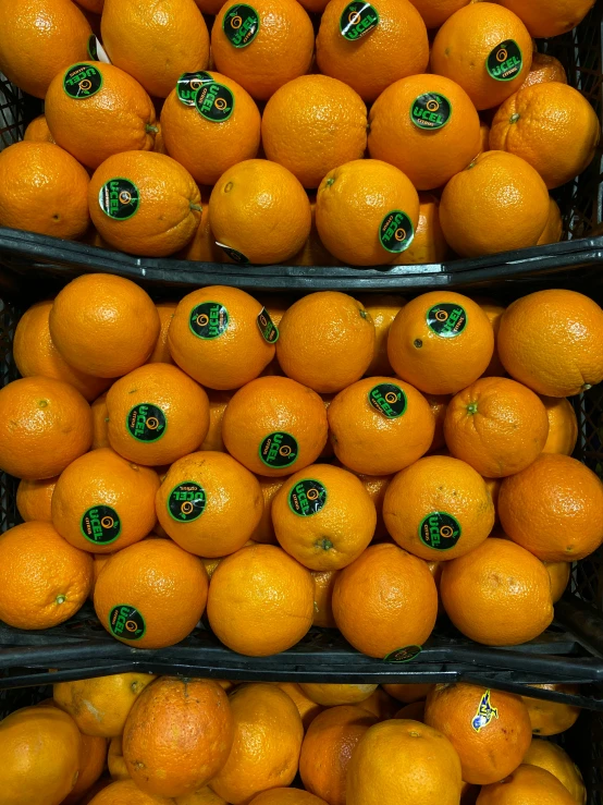 there are many baskets filled with tangerines together