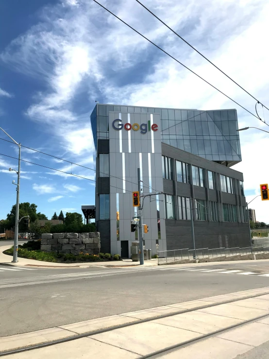 a building on the side of the road with the google logo on it