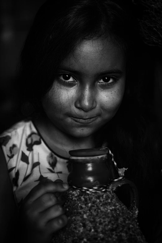 an image of girl smiling holding a vase