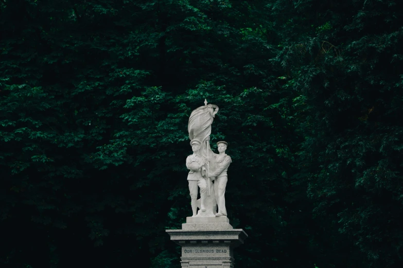 a sculpture of a man with an umbrella on top of a statue