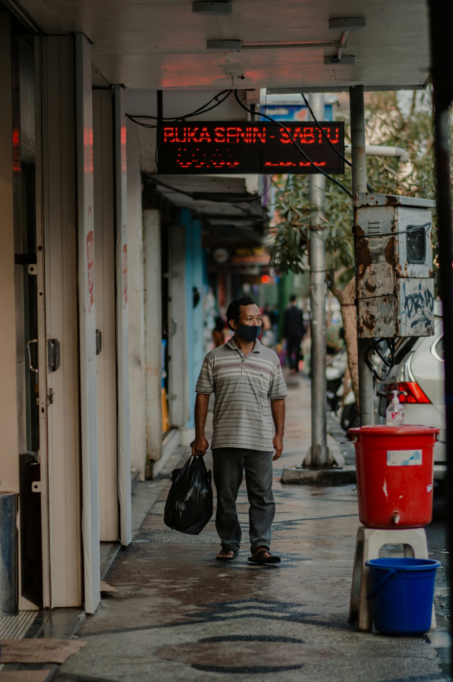 a man that is walking down the street