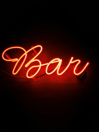 a neon sign reading bann hanging from the wall