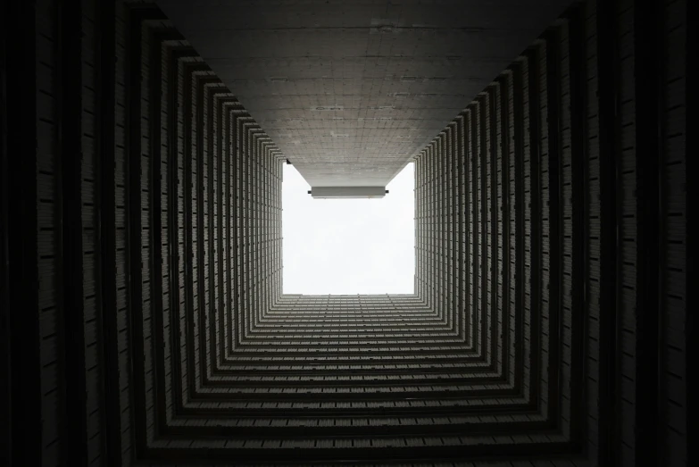 several rows of empty bottles fill the center of an underground space