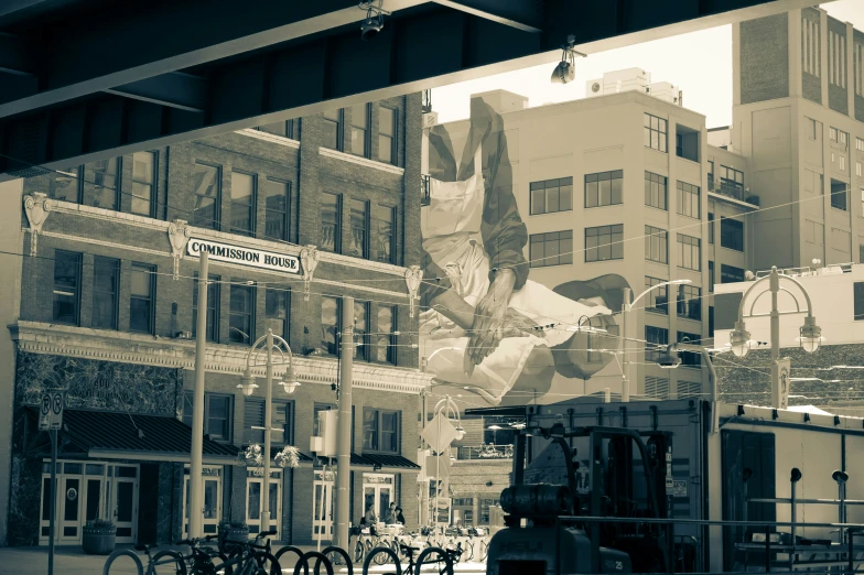 the reflection in a window of some buildings and bicycles