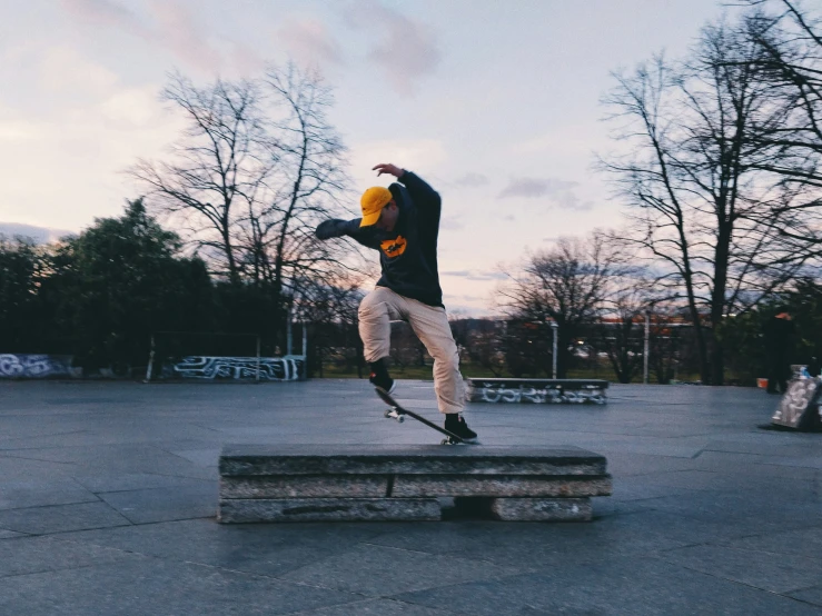 a boy performs a jump on his skateboard