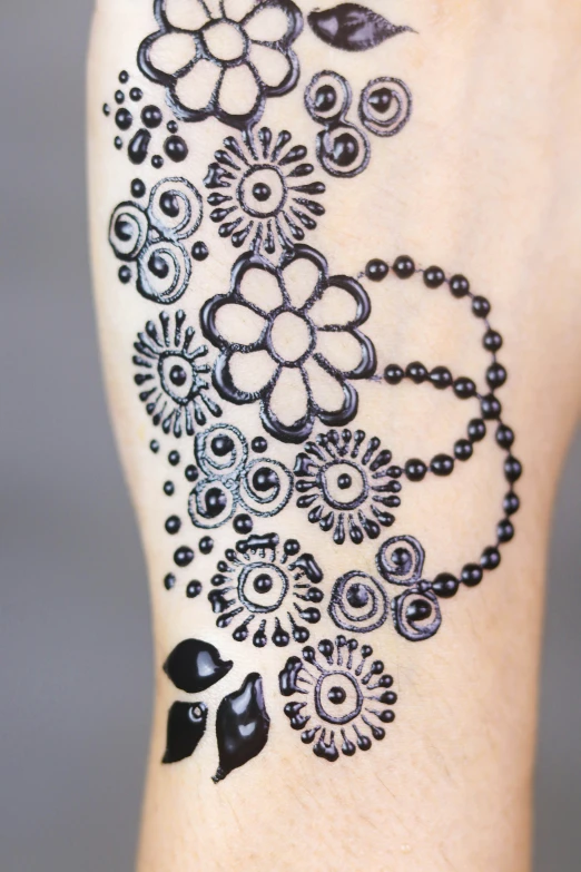 a tatoo on the arm that has some kind of designs
