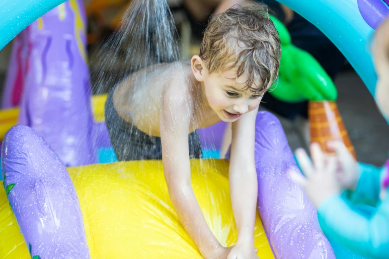 a boy falling off of a play house