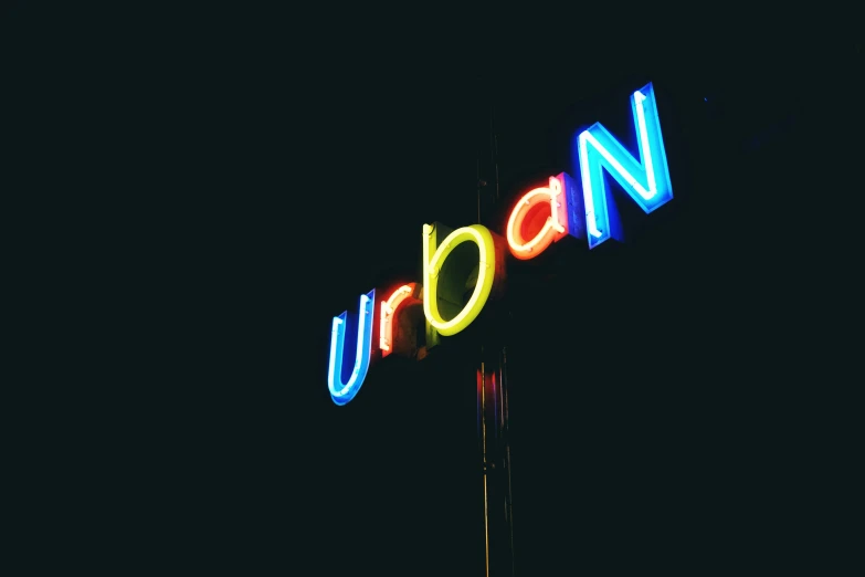an urban sign lit up at night