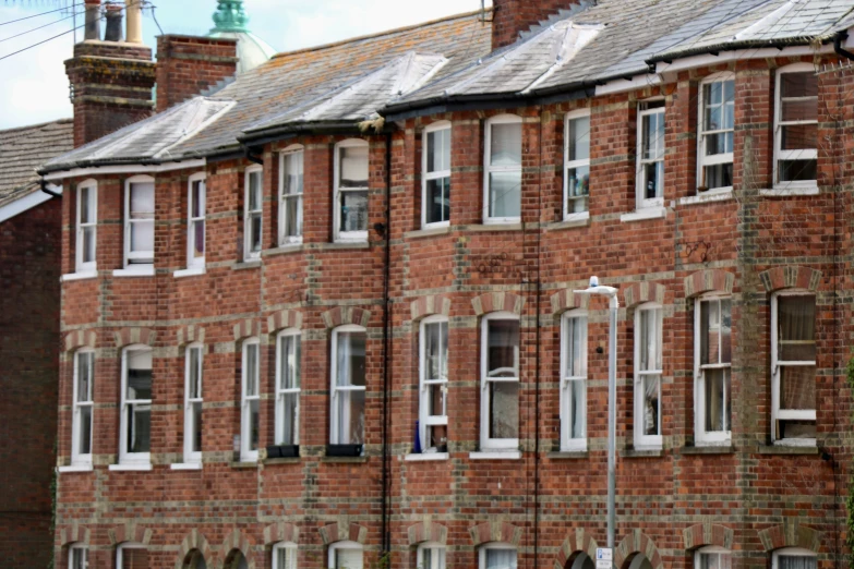 a close up of a number of windows on a brick building