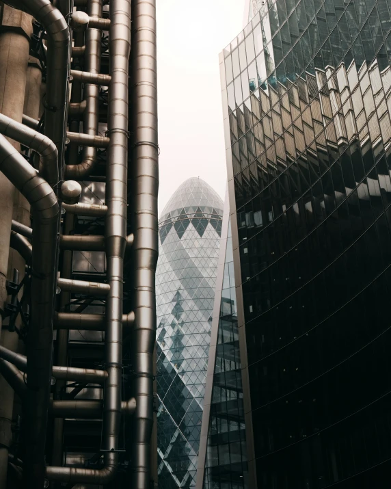 a view of skyscrs from ground level of the building