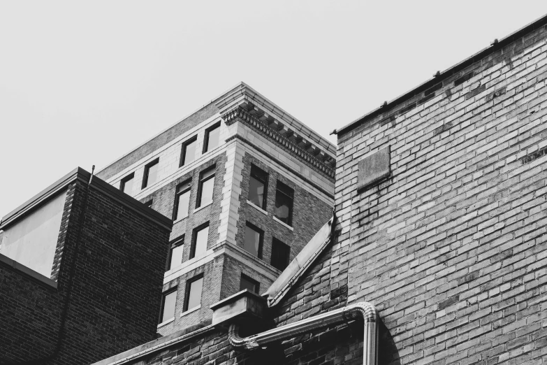 black and white image of two buildings facing one another