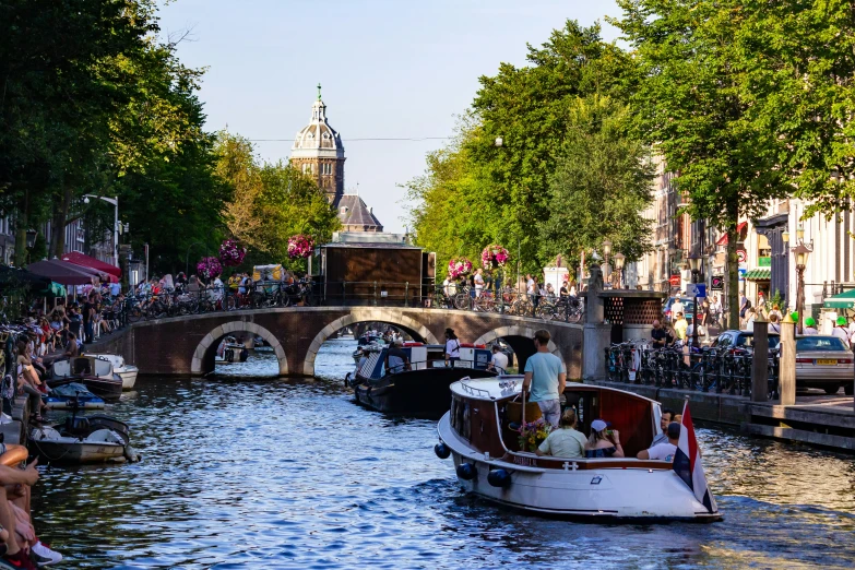 a canal full of people and small boats