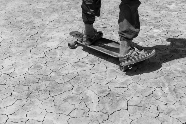 a man with his feet up riding a skateboard