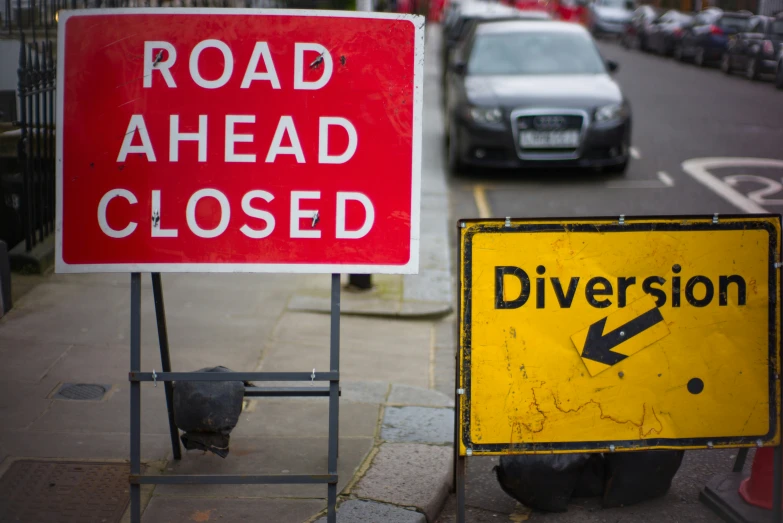 street signs, on the side of a road