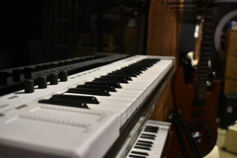 an electronic piano with many black keys