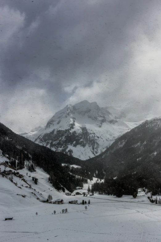 a snow covered mountain range in the distance