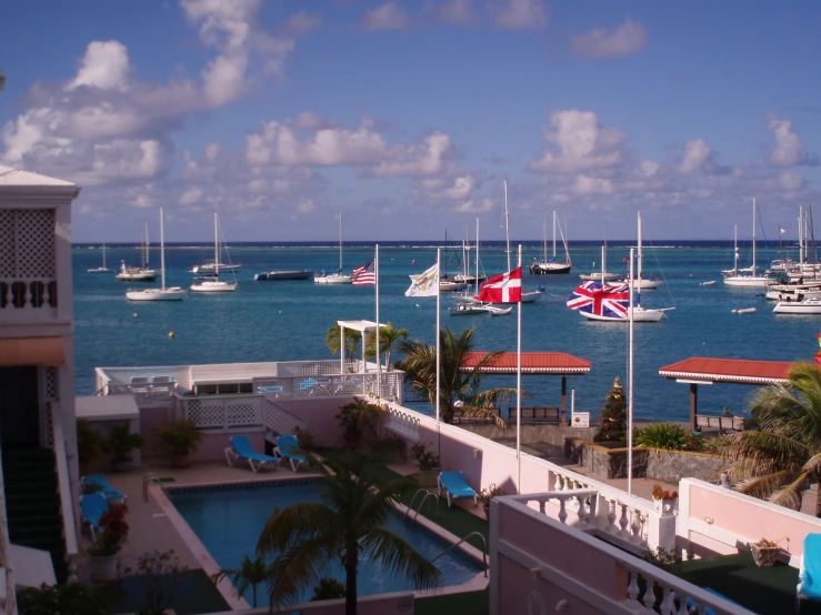 the ocean is full of boats that are sailing near the dock