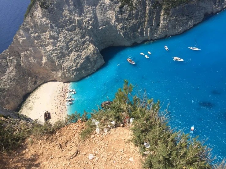 a beach on a cliff by the water