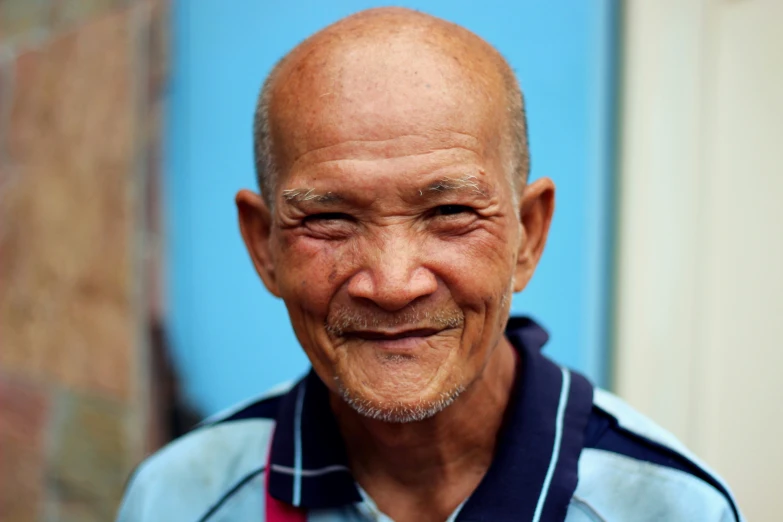 a close up of a person with a bald head