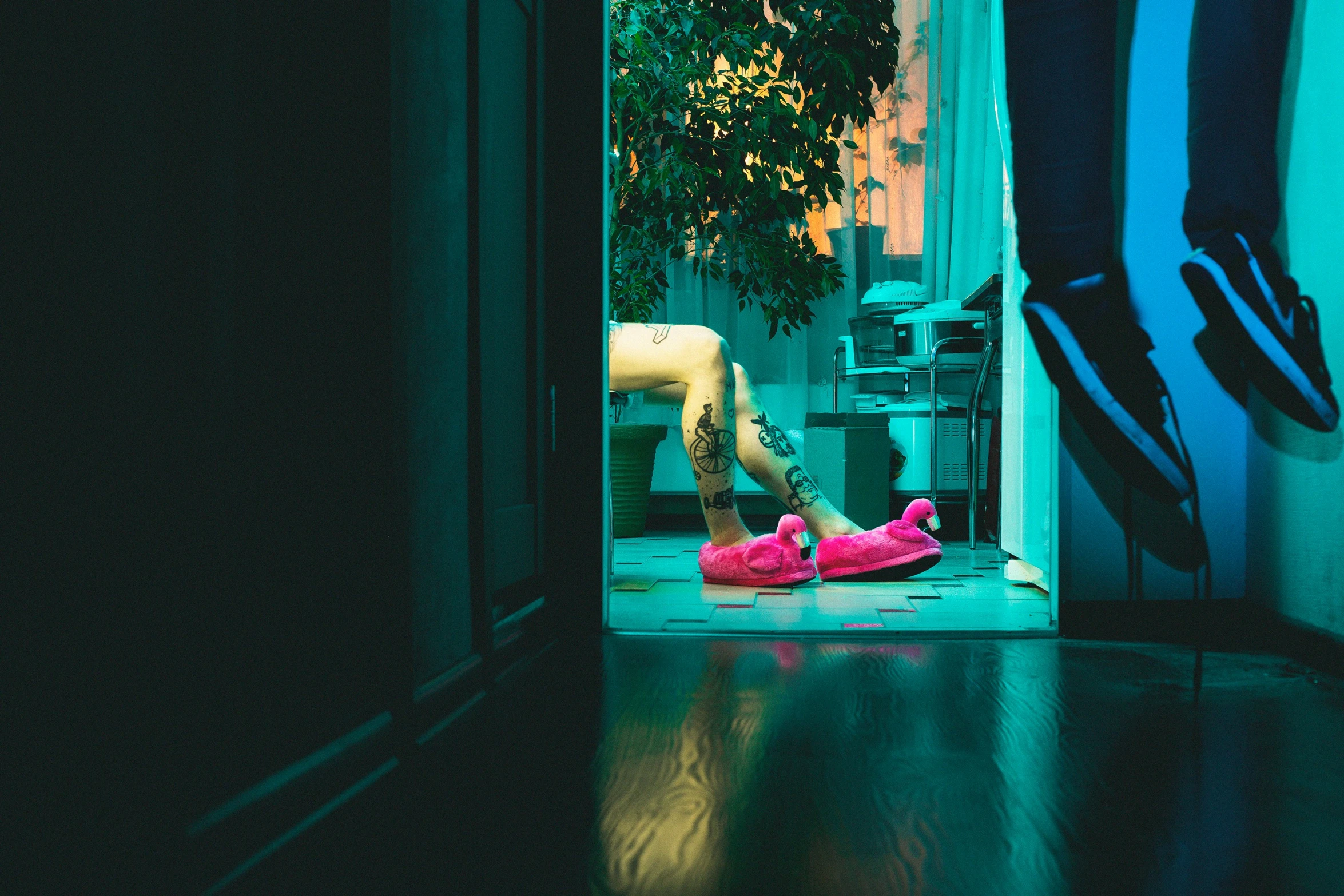 a pink shoe is on the floor in front of a doorway