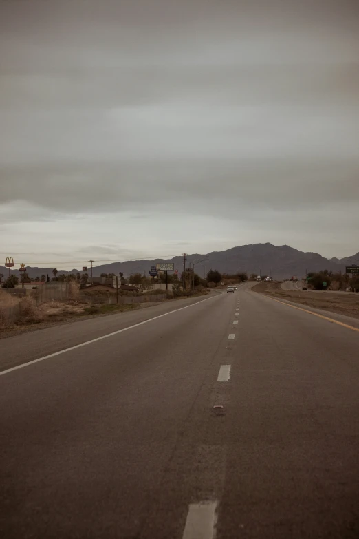 a empty street sits empty on an overcast day