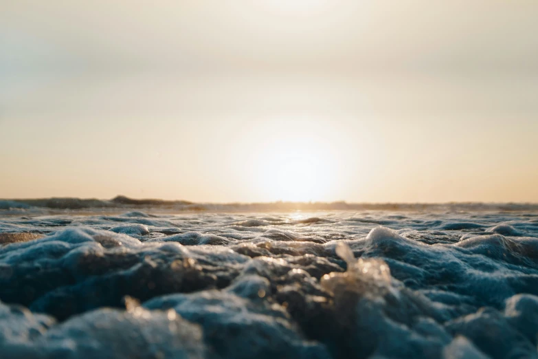 some very pretty water waves and the sun