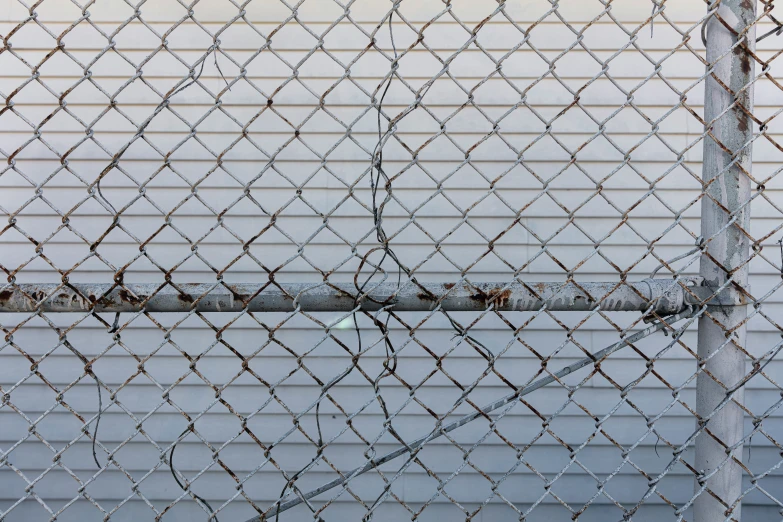 a close up view of some wire on the side of a building