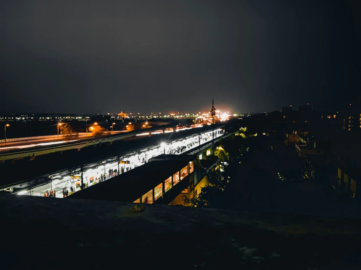 a train traveling through a city at night