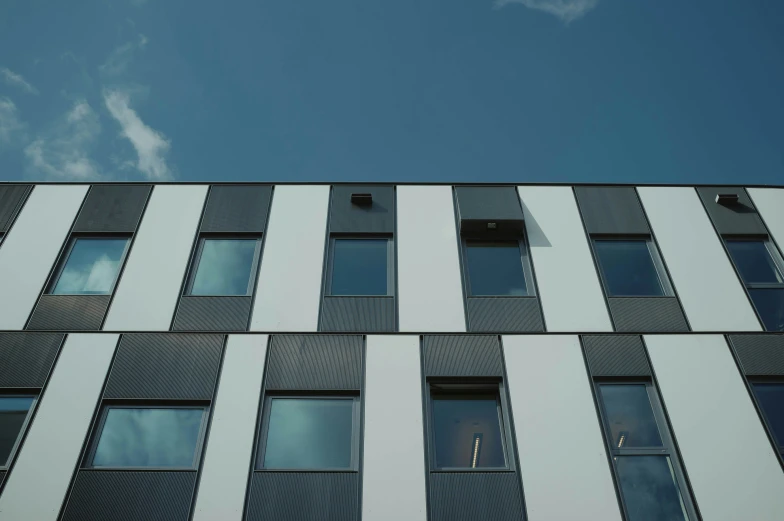 a close - up view of a modern building with multi - story windows