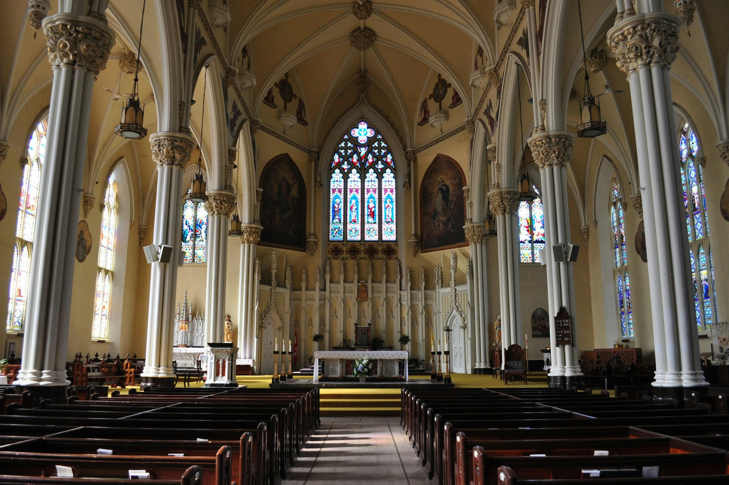 a church with large windows, and pillars