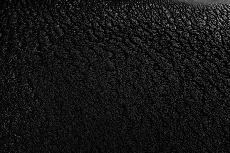 an black and white po of the texture of a wall