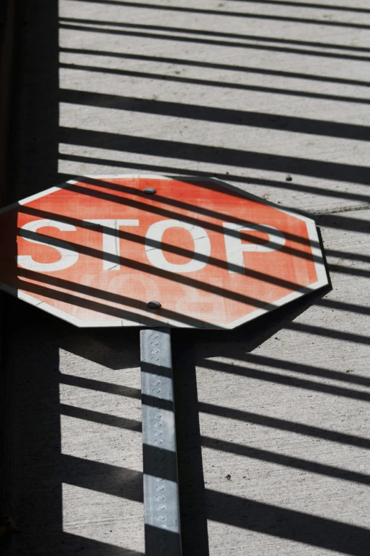 a stop sign that is on the ground