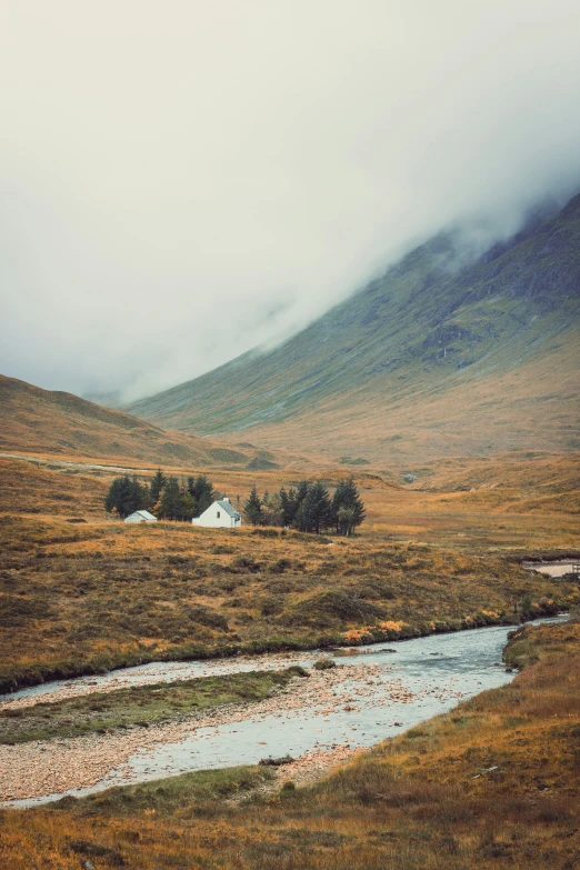 a beautiful scenery of a valley with a stream