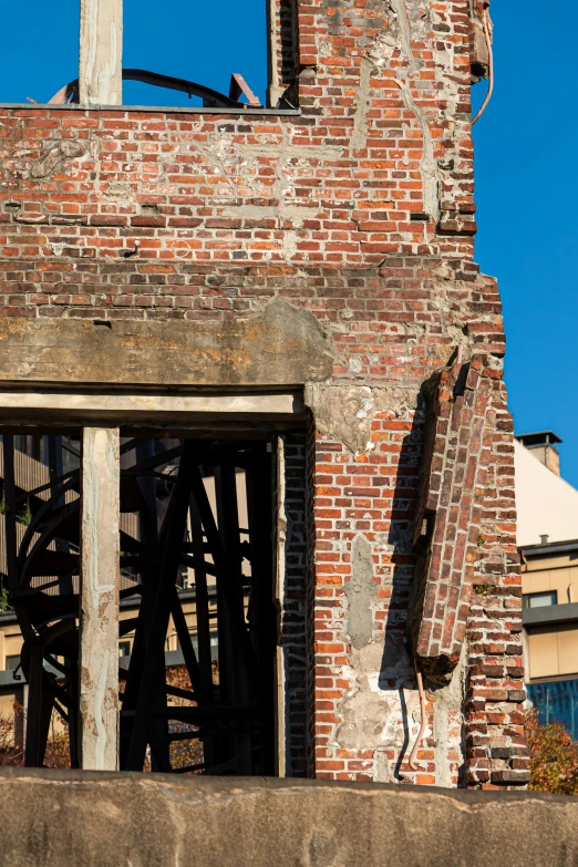 a clock mounted to the side of a brick building