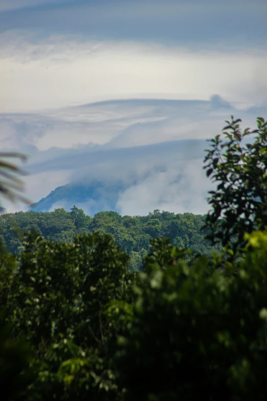 a large amount of cloud covered mountains on a cloudy day