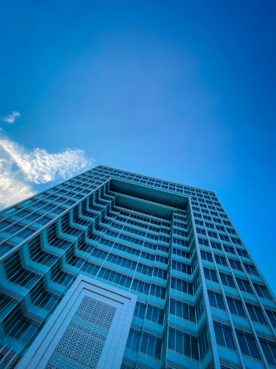 a high rise building with a blue sky
