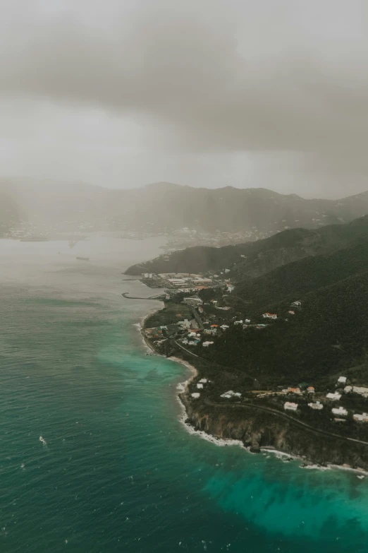 an aerial view of a town in the ocean