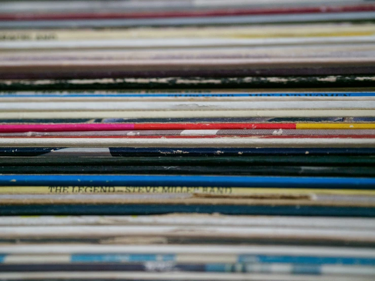 many different colored papers and some are stacked up