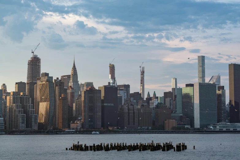 a cityscape with a dock in the foreground