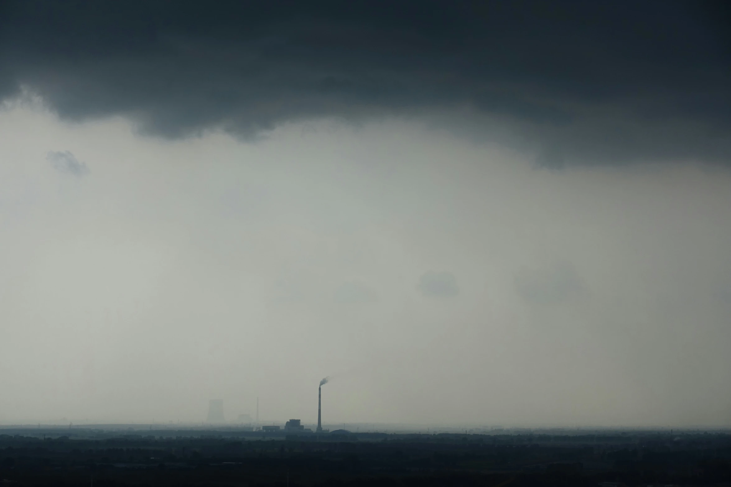 a sky view looking across the ocean at a ship in the distance